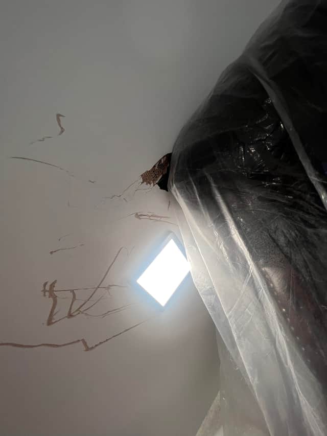 The sofa stuck on the stairs. See SWNS story SWLNsofa. A homeowner has slammed a furniture company after they abandoned a failed attempt to deliver new sofa - leaving it jammed on the stairs. Luke Ansell, 27, had just moved in to his brand new £500k home in Bournemouth in December when he bought an over £2,000 sofa that was delivered on January 19. Despite delivery-men assuring him that they made tight deliveries 'all the time' - the pair from designersofasforyou.co.uk failed to get the new sofa-bed up a narrow staircase, before abandoning it. Photos of the shocking attempted delivery show how the pair left huge holes in the staircase plasterwork, and damage to the woodwork, before leaving.