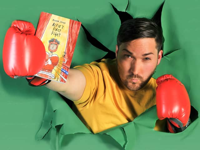 Oliver Sykes with his book Alfie’s First Fight, which he now has a touring show for children based on. Photo: Oliver Sykes