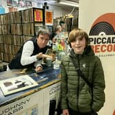 John Denton with his guitar hero Johnny Marr at Piccadilly Records, Manchester. Credit: Phil Denton / SWNS