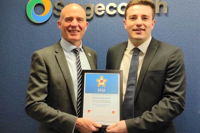 Stagecoach manager Zachary MsAskill receiving his Star of the Month award for his bravery in stopping a knife attack outside his office. Credit: Stagecoach