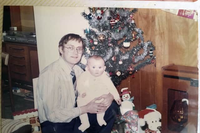 Edward Kopec at home with his baby daughter Maria in the 1970s or ‘80s. Photo shared by the Kopec family
