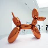 A woman accidentally destroyed a Jeff Koons glass sculpture believing it to be a balloon dog.