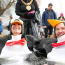 Councillors Eve Holt and Mathew Benham took the plunge dressed, appropriately enough, as penguins. Photo: Dylan O’Brien