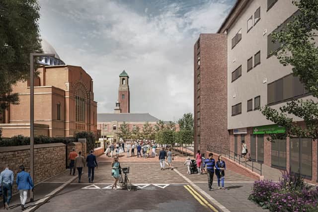 A view of the Station Square could look from a side street. St John the Baptist Church is on the left, with Nye Bevan House on the right Credit: Rochdale Council