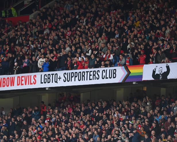 The Rainbow Devils LGBTQ+ Supporters club banner is shown in the East stand during the Premier League match between Manchester United and Newcastle United at Old Trafford on October 16, 2022
