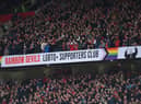 The Rainbow Devils LGBTQ+ Supporters club banner is shown in the East stand during the Premier League match between Manchester United and Newcastle United at Old Trafford on October 16, 2022