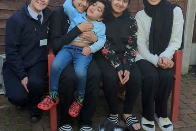 RSPCA inspector Rachel Henderson with Raffi and Ibraheem Mustafa (14), Muhammad Ali bin Adil (4), Khadeeja Mustafa (11) and Maryam Mustafa (15