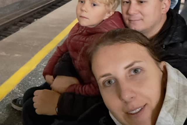 Natalia Hrubova with her son and husband, sheltering in a subway station during an air raid. Credit: Natalia Hrubova