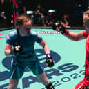 Izzy McGaughey (in blue) fighting in her gold medal match at the 2022 IMMAF World Championships in Serbia. Photo: IMMAF