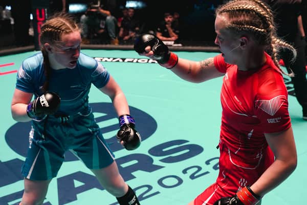 Izzy McGaughey (in blue) fighting in her gold medal match at the 2022 IMMAF World Championships in Serbia. Photo: IMMAF
