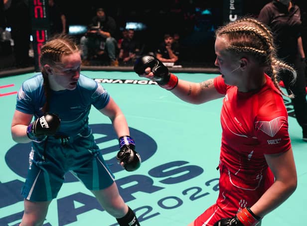 Izzy McGaughey (in blue) fighting in her gold medal match at the 2022 IMMAF World Championships in Serbia. Photo: IMMAF