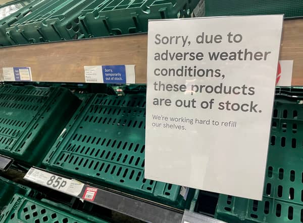 Empty shelves are seen in the fruit and vegetable aisles of a Tesco supermarket on February 22 in Burgess Hill.
