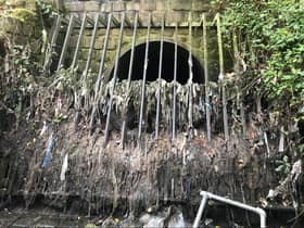 A combined sewer overflow discharging into the River Tame in Greater Manchester with its grill full of wet wipes and sanitary products . Photo: Jamie Woodward