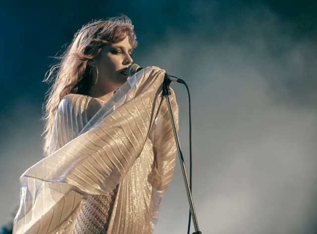 Riley Keough as Daisy Jones in Daisy Jones & The Six, performing in a style reminiscent of Stevie Nicks (Credit: Lacey Terrell/Prime Video)