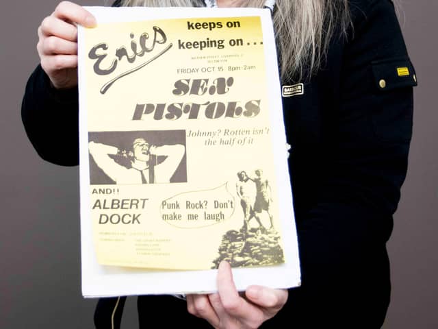 Claire Howell, music memorabilia consultant at Hansons Auctioneers, with the Sex Pistols poster.  