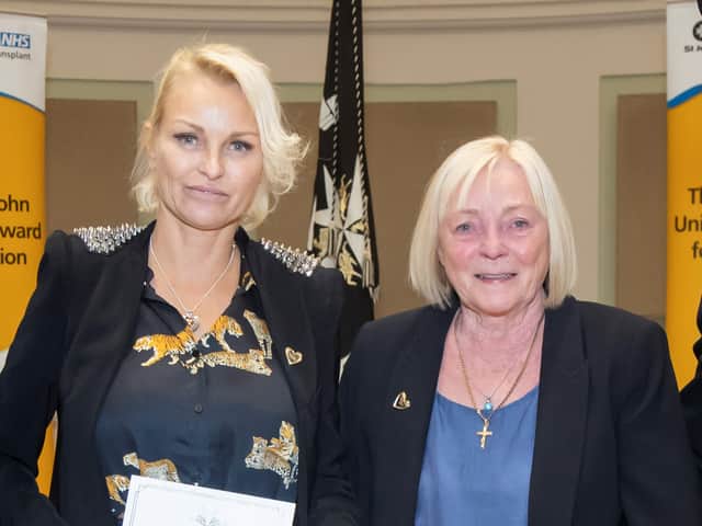 Louise Callaghan and Carole Williams collecting the Order of St John UK Award for Jacob