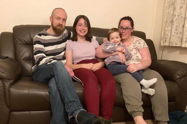 Jasmine Allmond with daughters Haylee and Karina, and husband Chris Allmond.