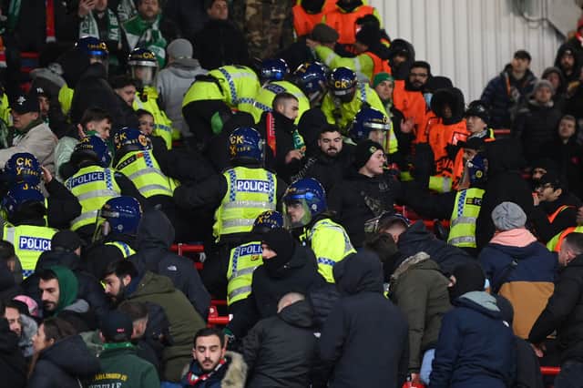 Police are seen in the stands with Real Betis tackling the disorder in the Man Utd game Credit: Getty