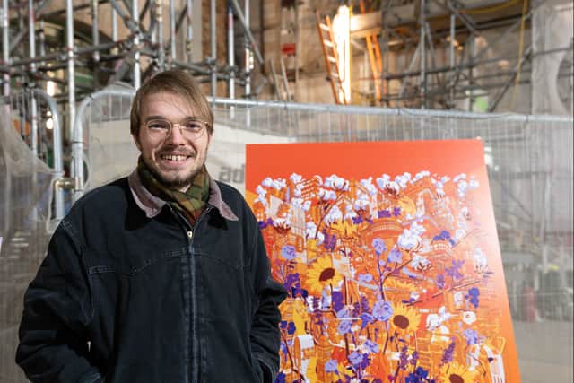 Artist Alex Sylt with his winning design. Photo: Edward Jones
