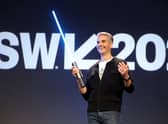 Josh D’Amaro, Disney’s parks and experiences chairman, with a ‘real’ Star Wars lightsaber