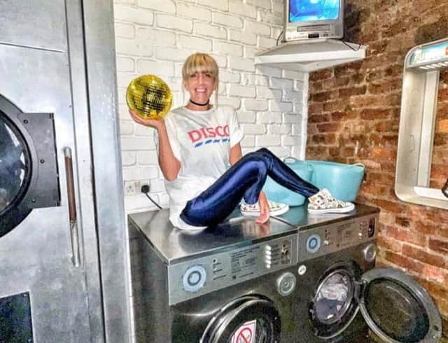 DJ Emma Charles at the Washhouse, Manchester in the laundrette entrance Credit: Emma Charles / SWNS