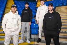 Cerebral Clothing founders Dan Lloyd and Charley Rich (centre) flanked by Warrington Wolves rugby league players and brand supporters Pete Mata’utia and Stefan Ratchford