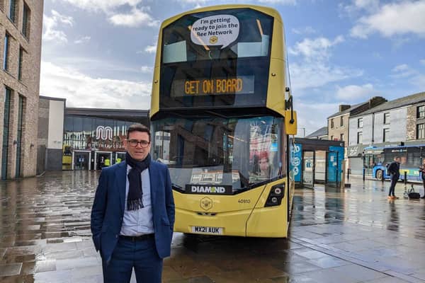Mayor Andy Burnham with one of Manchester’s new Bee Network buses Credit: LDRS