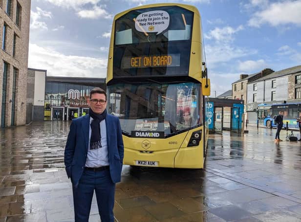 Mayor Andy Burnham with one of Manchester’s new Bee Network buses Credit: LDRS
