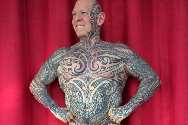 Ray Houghton has tattoos all over his body Credit: swns