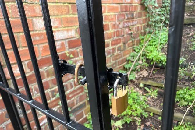 A padlock has appeared on the Barton Upon Irwell Graveyard