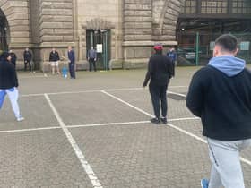 The cricketers passing the time at Dover with an impromptu match (Photo: SWNS)
