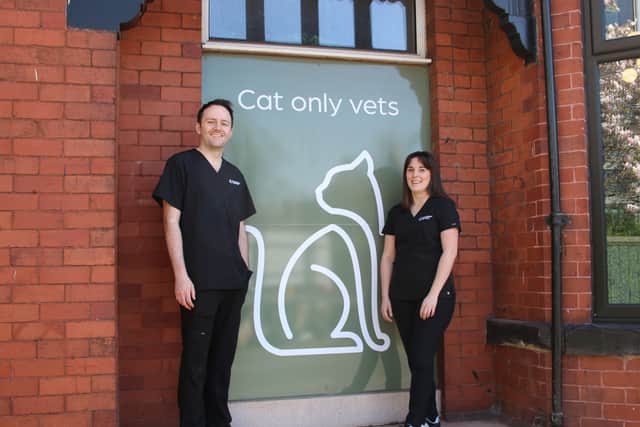 Dan and Ellie Lee outside the Withington building they are in the process of turning into Manchester Cat Clinic