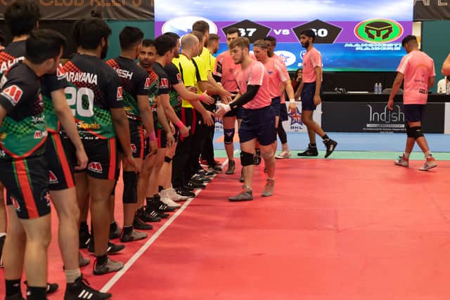 Manchester Raiders (in the black, green and red kit) shake hands with Edinburgh Eagles before a match in last season’s competition