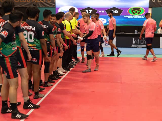 Manchester Raiders (in the black, green and red kit) shake hands with Edinburgh Eagles before a match in last season’s competition