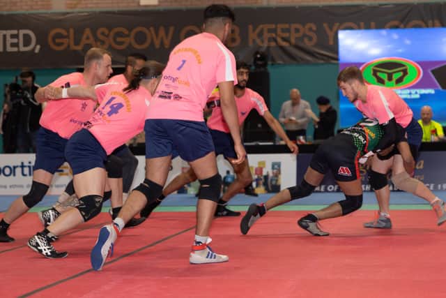 A player for the Manchester Raiders attempting a raid on the Edinburgh Eagles