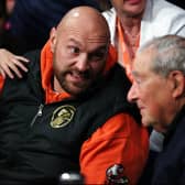 Boxer Tyson Fury speaks with Promoter Bob Arum prior to the IBF, WBC, WBO World Light Heavyweight Title fight between Artur Beterbiev and Anthony Yarde  at OVO Arena Wembley on January 28, 2023 in London, England. (Photo by James Chance/Getty Images)