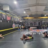 Training in progress at Manchester Top Team, with fighters practising grappling and using the cage. Photo: Andrew Nowell/National World