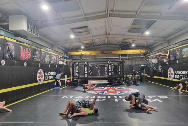 Training in progress at Manchester Top Team, with fighters practising grappling and using the cage. Photo: Andrew Nowell/National World