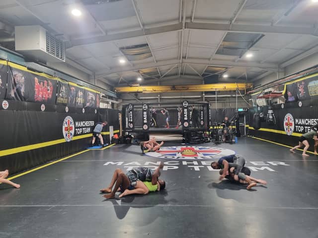 Training in progress at Manchester Top Team, with fighters practising grappling and using the cage. Photo: Andrew Nowell/National World