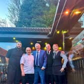 Sir Alex Ferguson posed for pictures with staff at Little Italy Restaurant, in Dronfield, Derbyshire Credit: SWNS