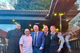 Sir Alex Ferguson posed for pictures with staff at Little Italy Restaurant, in Dronfield, Derbyshire Credit: SWNS