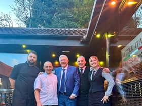 Sir Alex Ferguson posed for pictures with staff at Little Italy Restaurant, in Dronfield, Derbyshire Credit: SWNS
