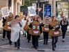 Campaigners dressed as poos and loo rolls stage ‘dirty protest’ in Manchester for Bowel Cancer Awareness Month
