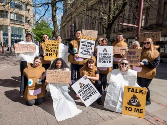 Campaigners raising awareness of bowel cancer on the streets of Manchester. Photo: Chris Payne