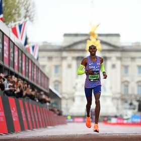 Sir Mo Farah crosses the line at the London Marathon; he will be at Manchester 10K soon. Photo: Getty Images