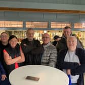 Regulars of the Queens pub in Monsall who gathered to show support for their favourite boozers Credit: LDRS