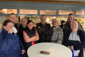 Regulars of the Queens pub in Monsall who gathered to show support for their favourite boozers Credit: LDRS