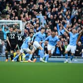 Manchester City celebrate in front of fans at the Etihad