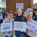 Protestors gather at the clock tower in the East Didsbury Tesco car park where the Blackbird Yard development is planned. Credit: Andrew Simcock
