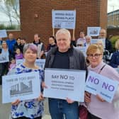 Protestors gather at the clock tower in the East Didsbury Tesco car park where the Blackbird Yard development is planned. Credit: Andrew Simcock